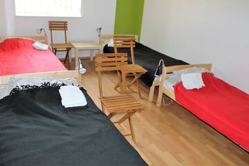 Односпальная кровать в общем номере с 4 кроватями в  Hostel Sparta